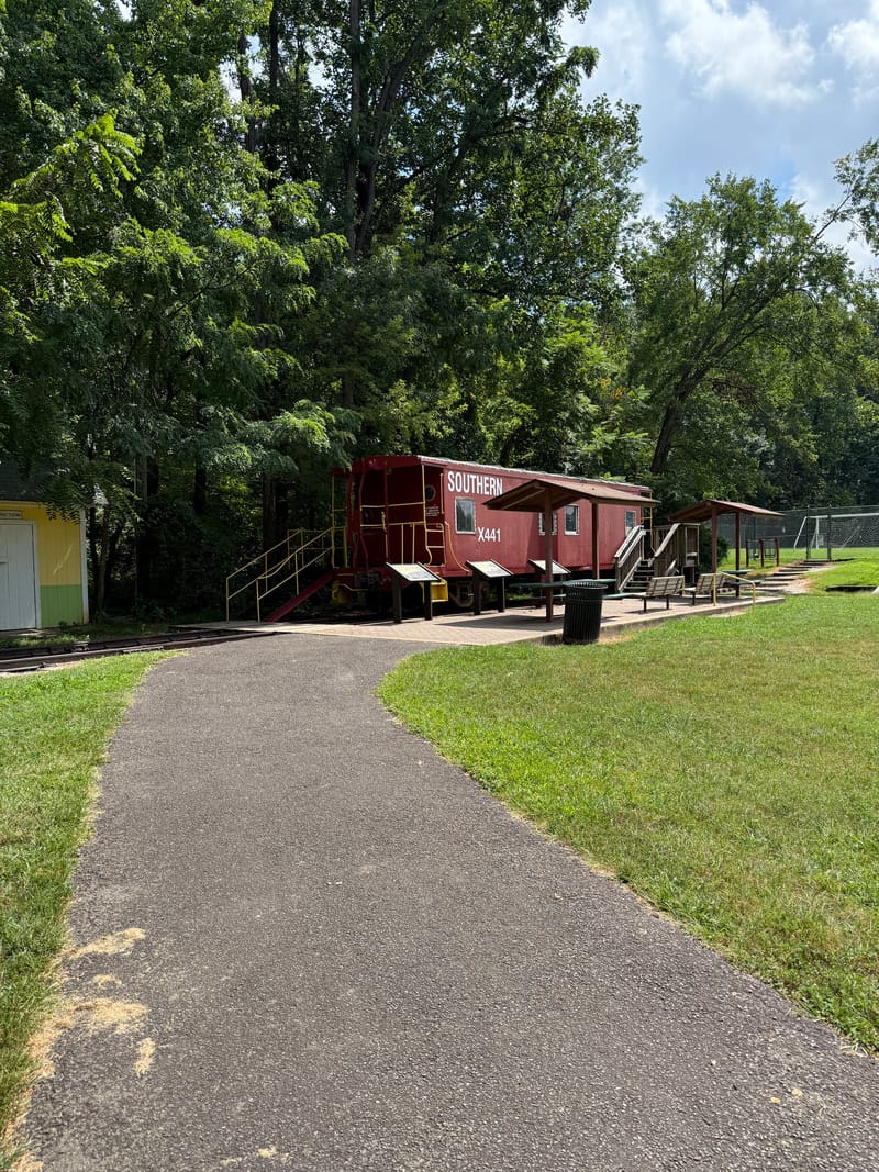 A second accessible picnic shelter with an accessible table down the West path at Bluemont Park