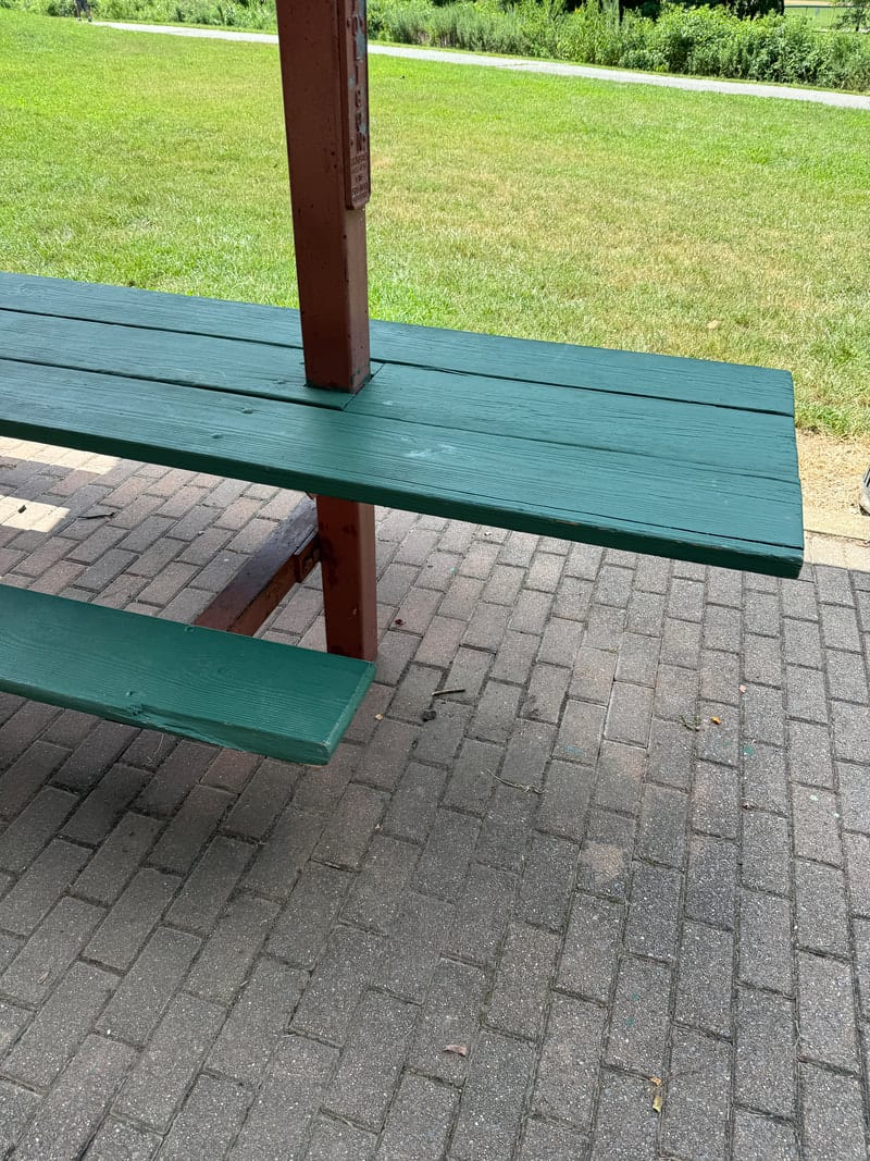 The spacious main picnic shelter at Bluemont Park with a wheelchair-accessible path
