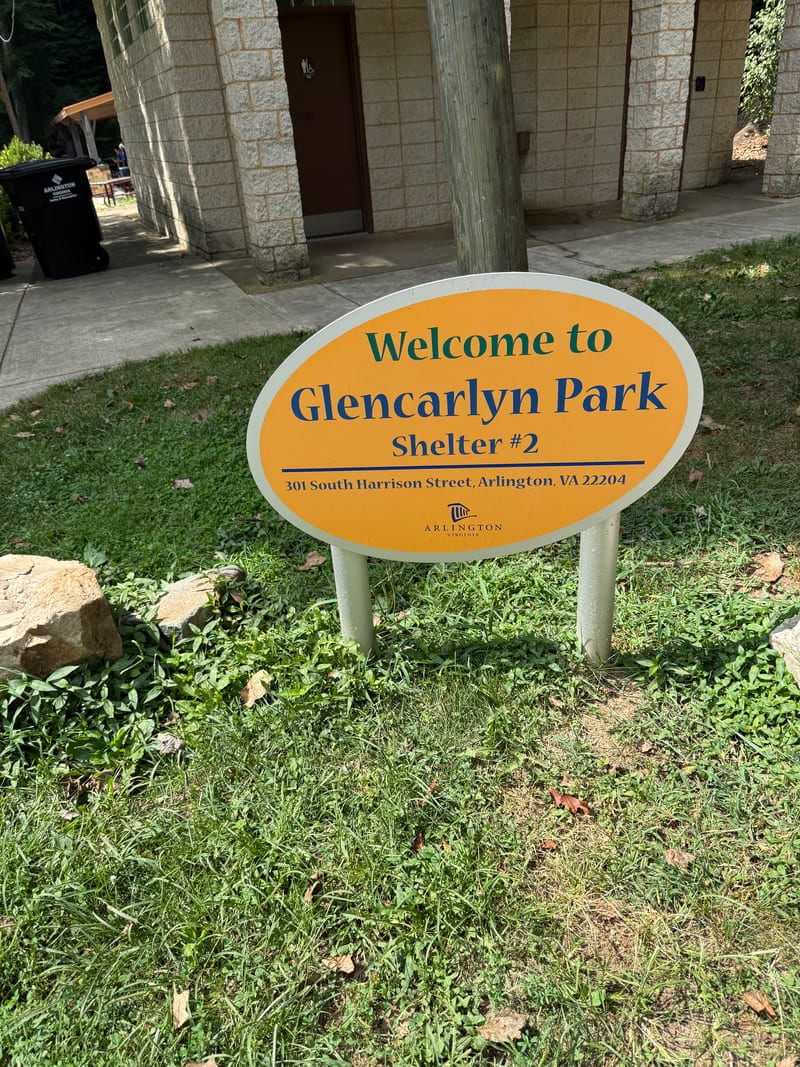 A high-contrast park sign at wheelchair-readable height at Glencarlyn Park