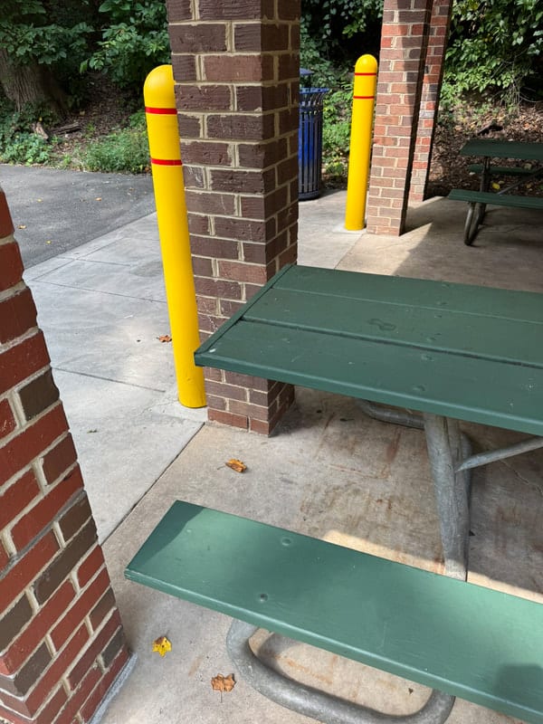 An accessible picnic shelter and trash can at Glencarlyn Park