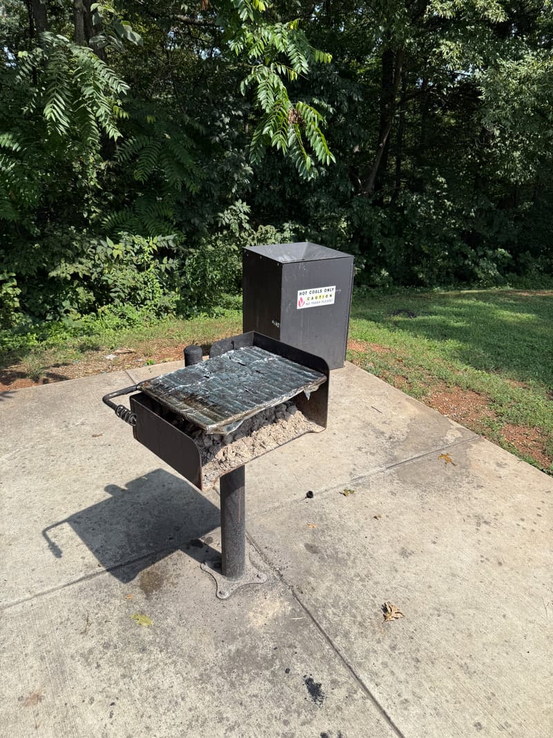 An accessible picnic table in the shelter at Tuscarora Park, positioned against a pillar