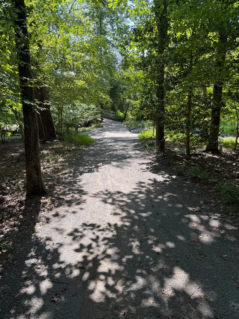 The partially paved, mostly flat trail toward the gazebo at Wolf Trap National Park