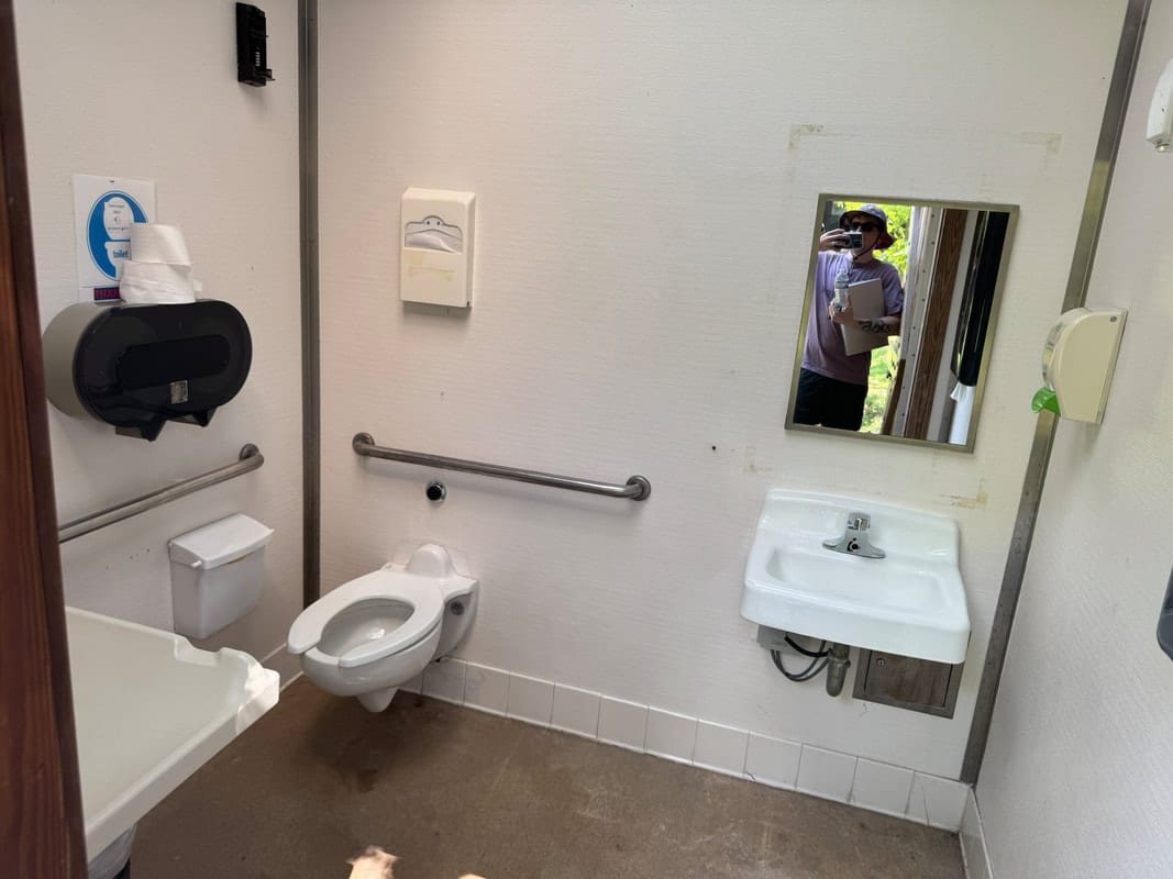 A family accessible bathroom with hand rails at Wolf Trap National Park