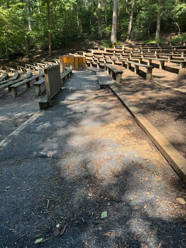 Well-placed accessible picnic tables in an uncovered seating area at Wolf Trap National Park